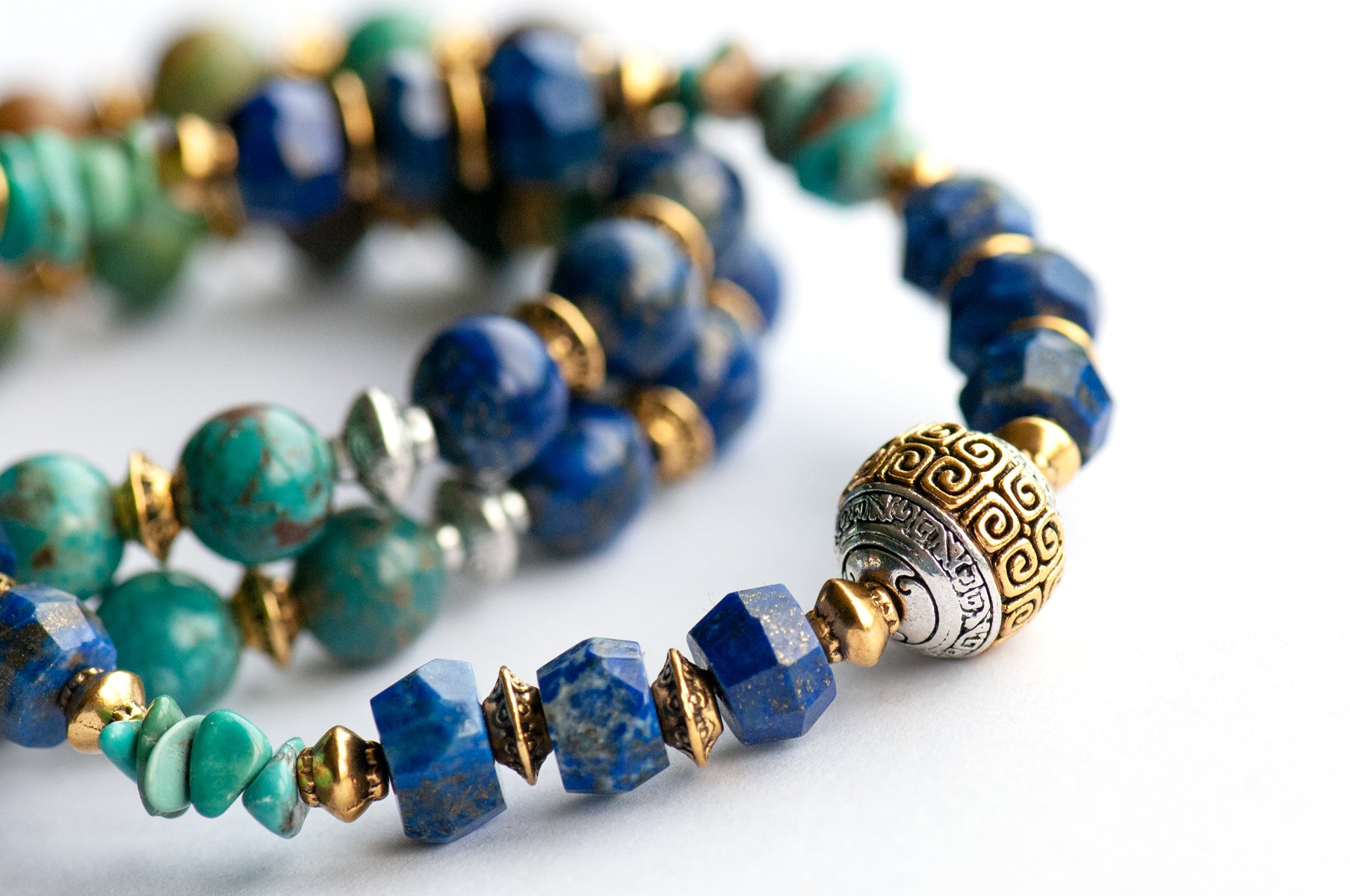 Fierce Harmony bracelet set featuring natural Lapis Lazuli rondelles, Hubei Turquoise chips, and Tibetan metal focal bead in antique silver and gold, with silver and gold spacers