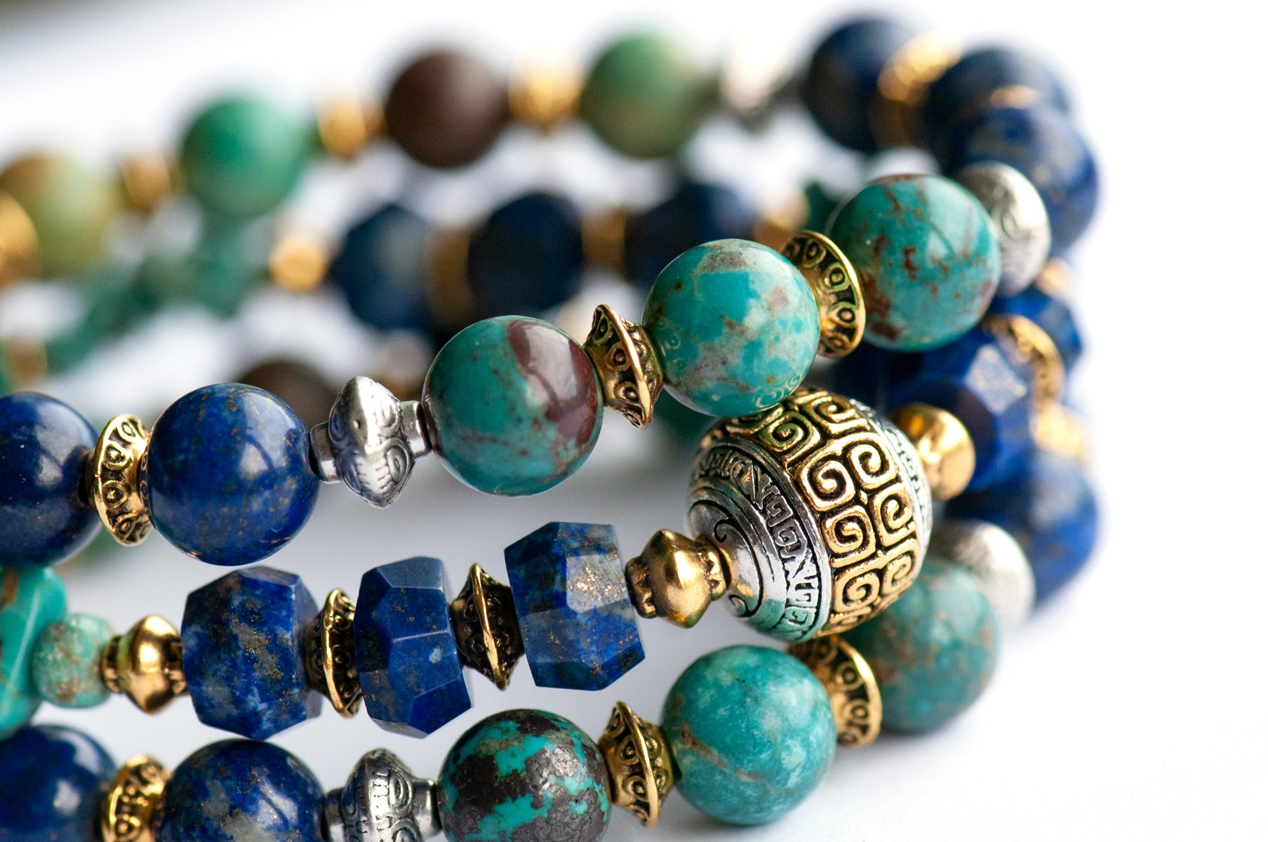 Fierce Harmony bracelet set featuring natural Lapis Lazuli rondelles, Hubei Turquoise chips, and Tibetan metal focal bead in antique silver and gold, with silver and gold spacers