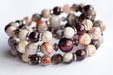 Fierce Strength bracelet set featuring red Garnet, Smoky Quartz rondelles, Laguna Lace Agate beads, and stainless steel spacers