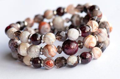 Fierce Strength bracelet set featuring red Garnet, Smoky Quartz rondelles, Laguna Lace Agate beads, and stainless steel spacers