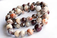 Fierce Strength bracelet set featuring red Garnet, Smoky Quartz rondelles, Laguna Lace Agate beads, and stainless steel spacers