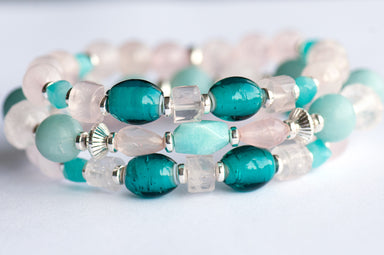 Fierce Affection bracelet set featuring Amazonite and Rose Quartz beads with turquoise white heart glass tube beads and silver-plated Hematite accents