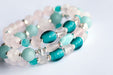 Fierce Affection bracelet set featuring Amazonite and Rose Quartz beads with turquoise white heart glass tube beads and silver-plated Hematite accents