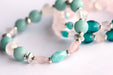 Fierce Affection bracelet set featuring Amazonite and Rose Quartz beads with turquoise white heart glass tube beads and silver-plated Hematite accents