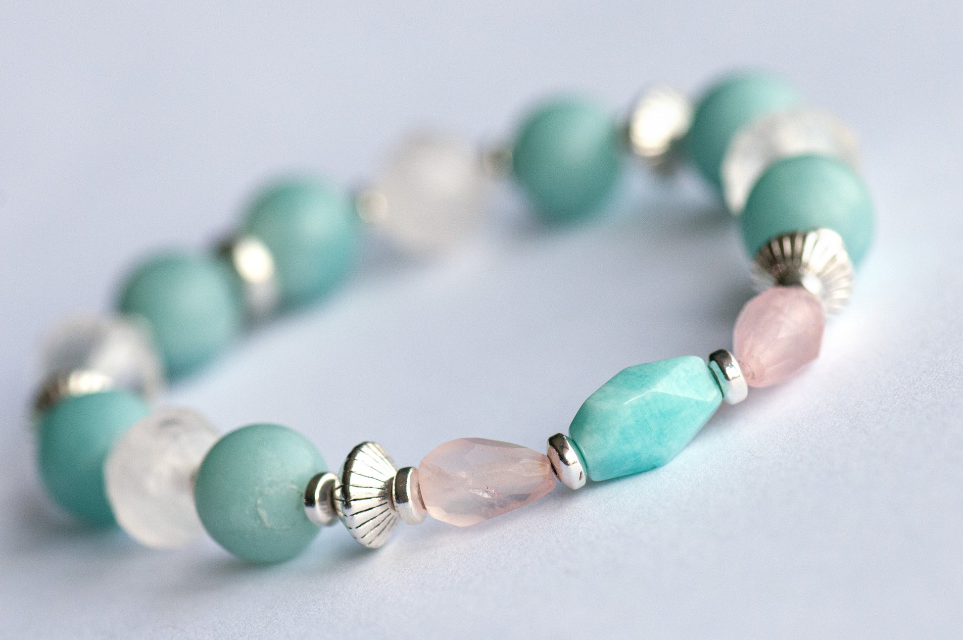 Fierce Affection bracelet set featuring Amazonite and Rose Quartz beads with turquoise white heart glass tube beads and silver-plated Hematite accents