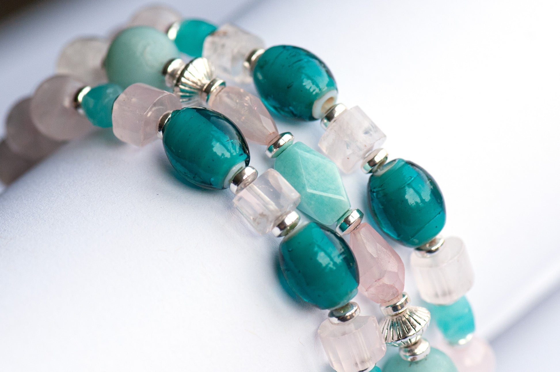 Fierce Affection bracelet set featuring Amazonite and Rose Quartz beads with turquoise white heart glass tube beads and silver-plated Hematite accents