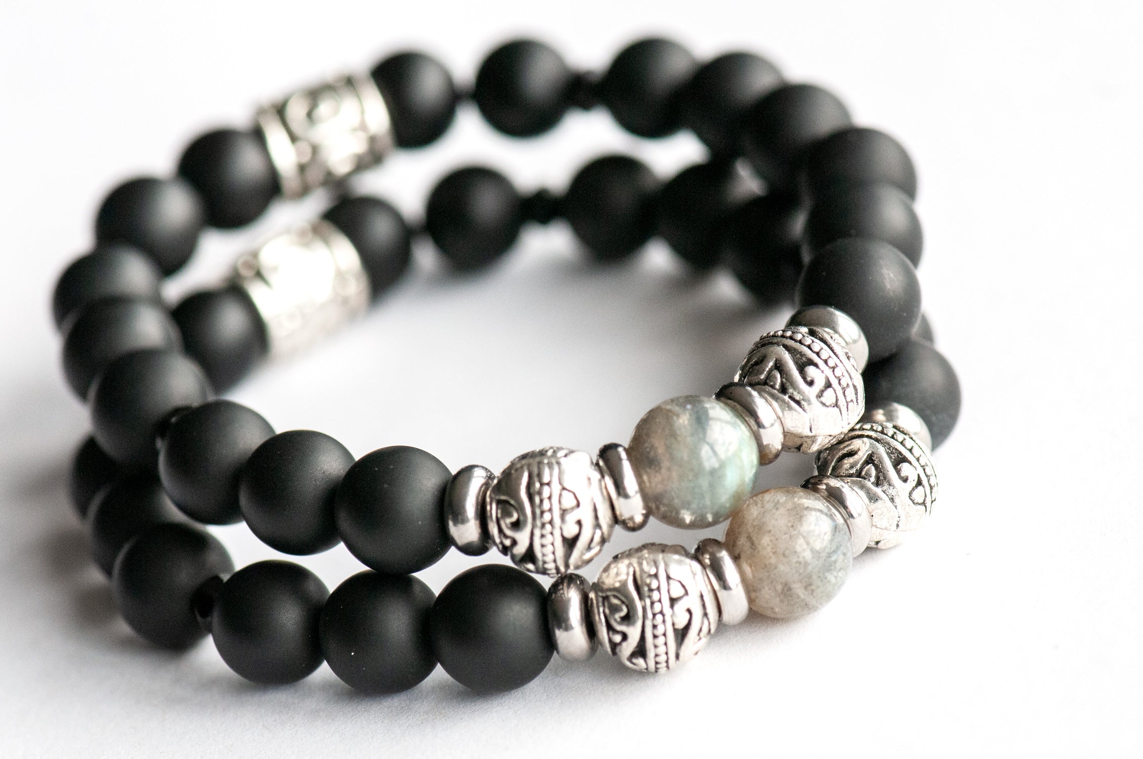 Supporting bracelets with Labradorite and frosted Black Agate beads in the Fierce Fortitude bracelet set.