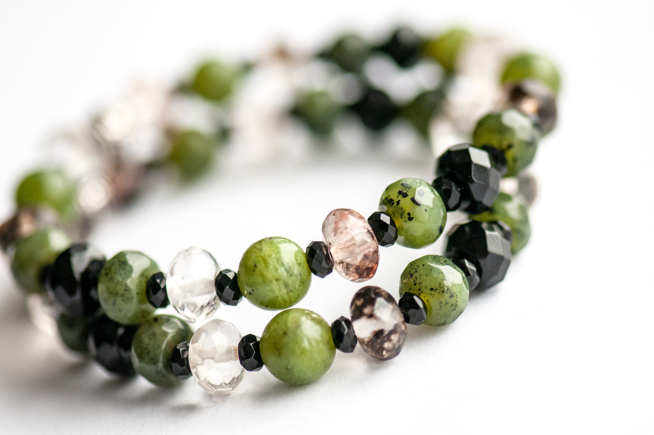 Supporting bracelets with Black Onyx, Canadian Jade, and black watermelon stone in the Fierce Loyalty set.