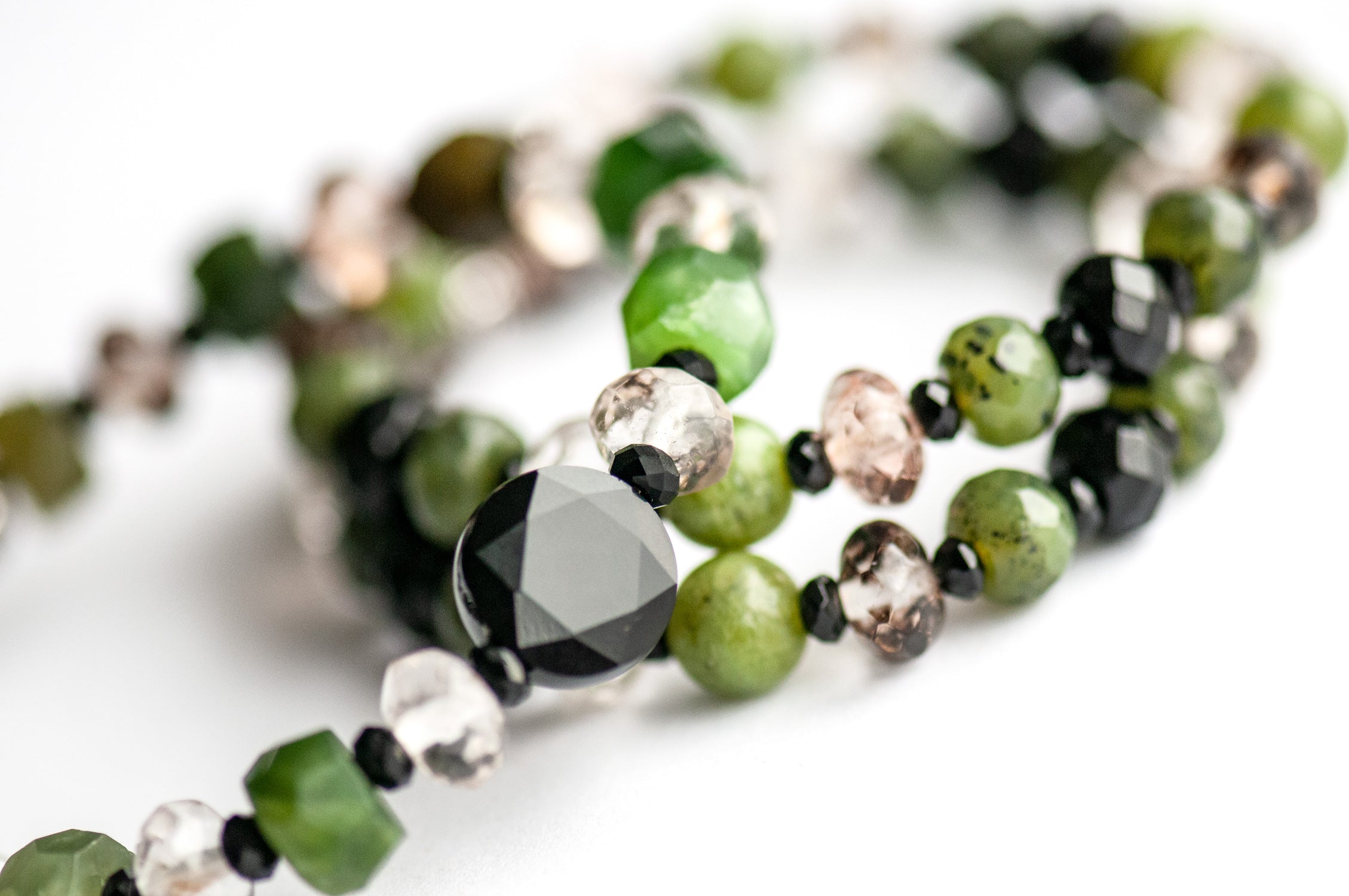 Close-up of Canadian Jade and Black Onyx beads in the Fierce Loyalty bracelet set.