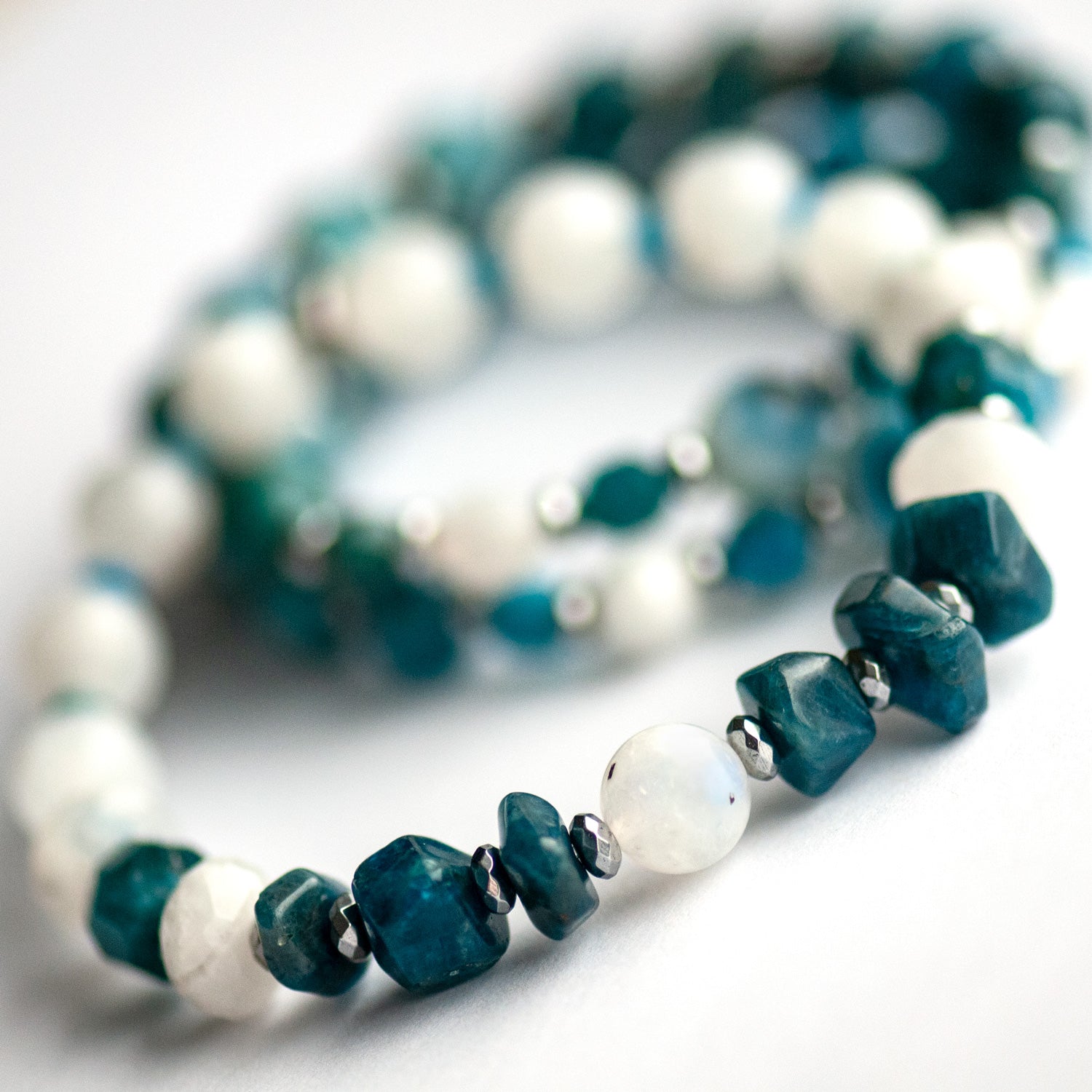 Close-up of Apatite chips and Rainbow Moonstone focal bead in the Fierce Expression bracelet.