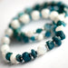 Close-up of Apatite chips and Rainbow Moonstone focal bead in the Fierce Expression bracelet.