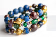 Festive Lynx bracelet set featuring Malachite focal bead with Lepidolite and Mica rounds.