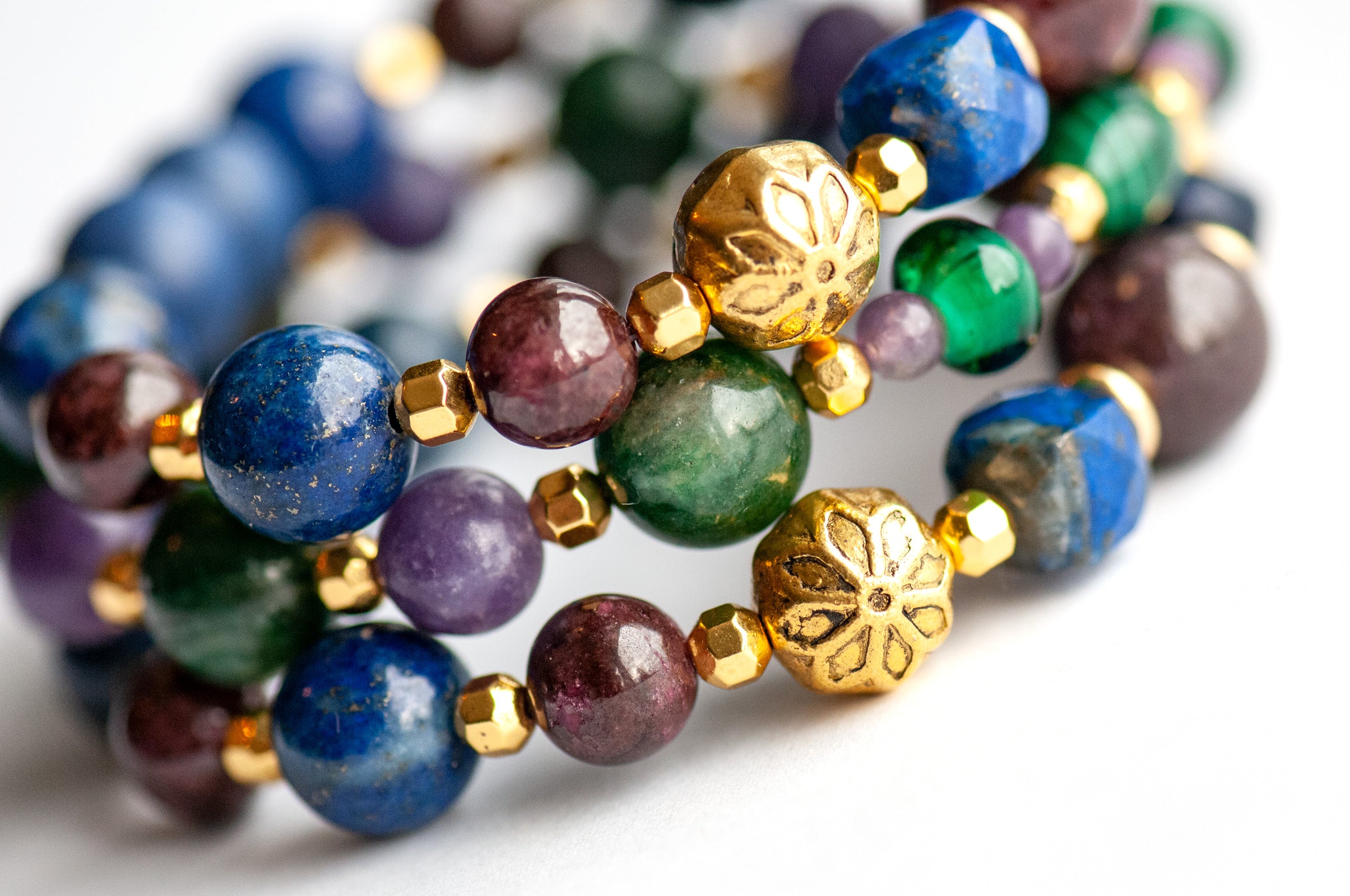 Festive Lynx bracelet set featuring Malachite focal bead with Lepidolite and Mica rounds.