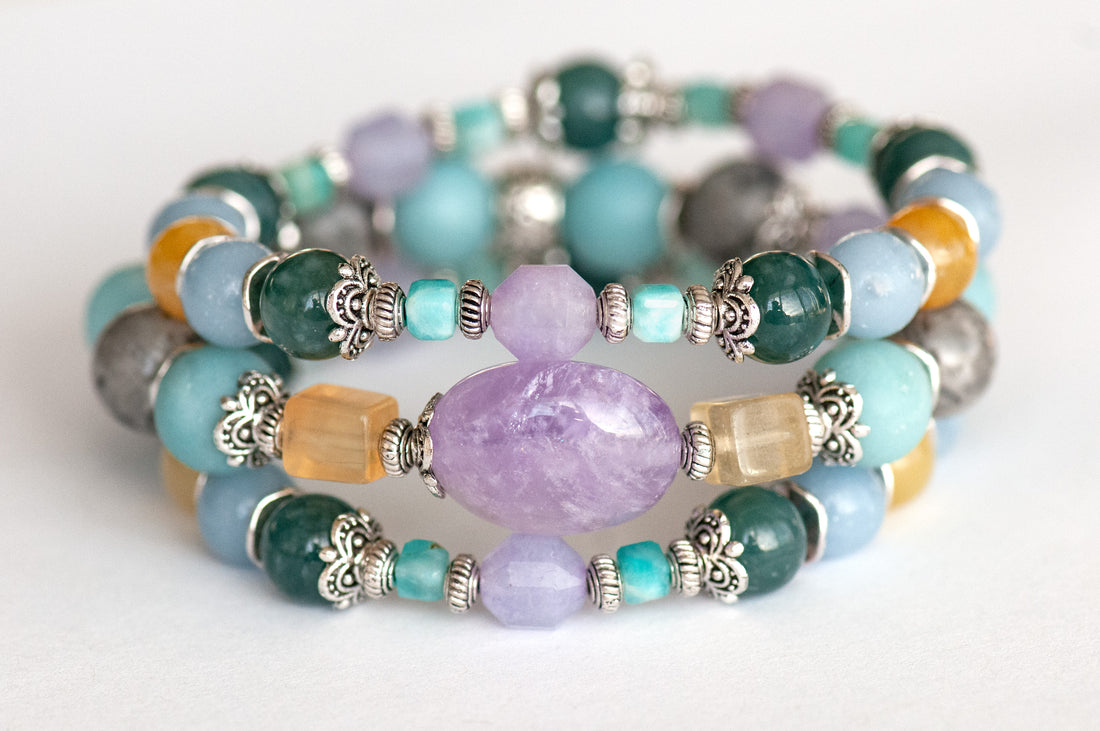 Impressionist Lynx bracelet set featuring lavender amethyst, yellow fluorite, Guatemalan jade, angelite, and amazonite, displayed in a soft, pastel colour palette.