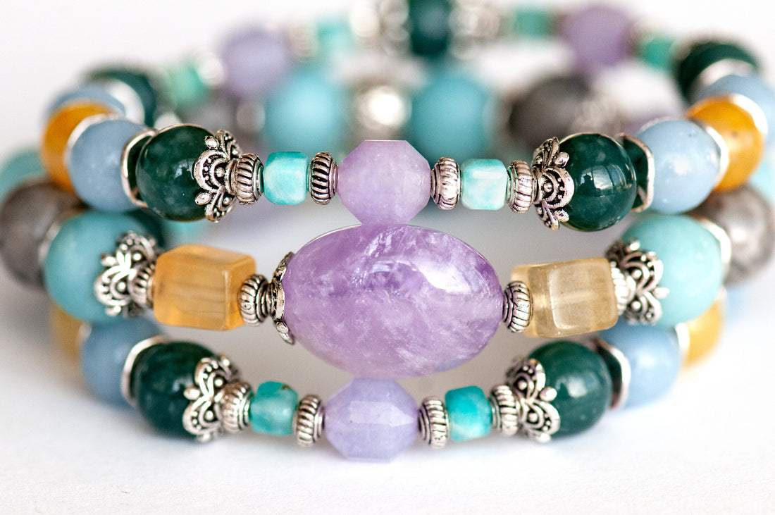 Impressionist Lynx bracelet set featuring lavender amethyst, yellow fluorite, Guatemalan jade, angelite, and amazonite, displayed in a soft, pastel colour palette.