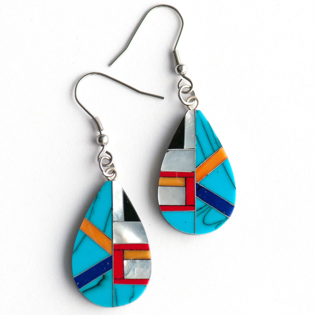 Turquoise & Pearl Teardrop Earrings featuring authentic turquoise, red and orange coral, and creamy Mother of Pearl in a black resin teardrop design.
