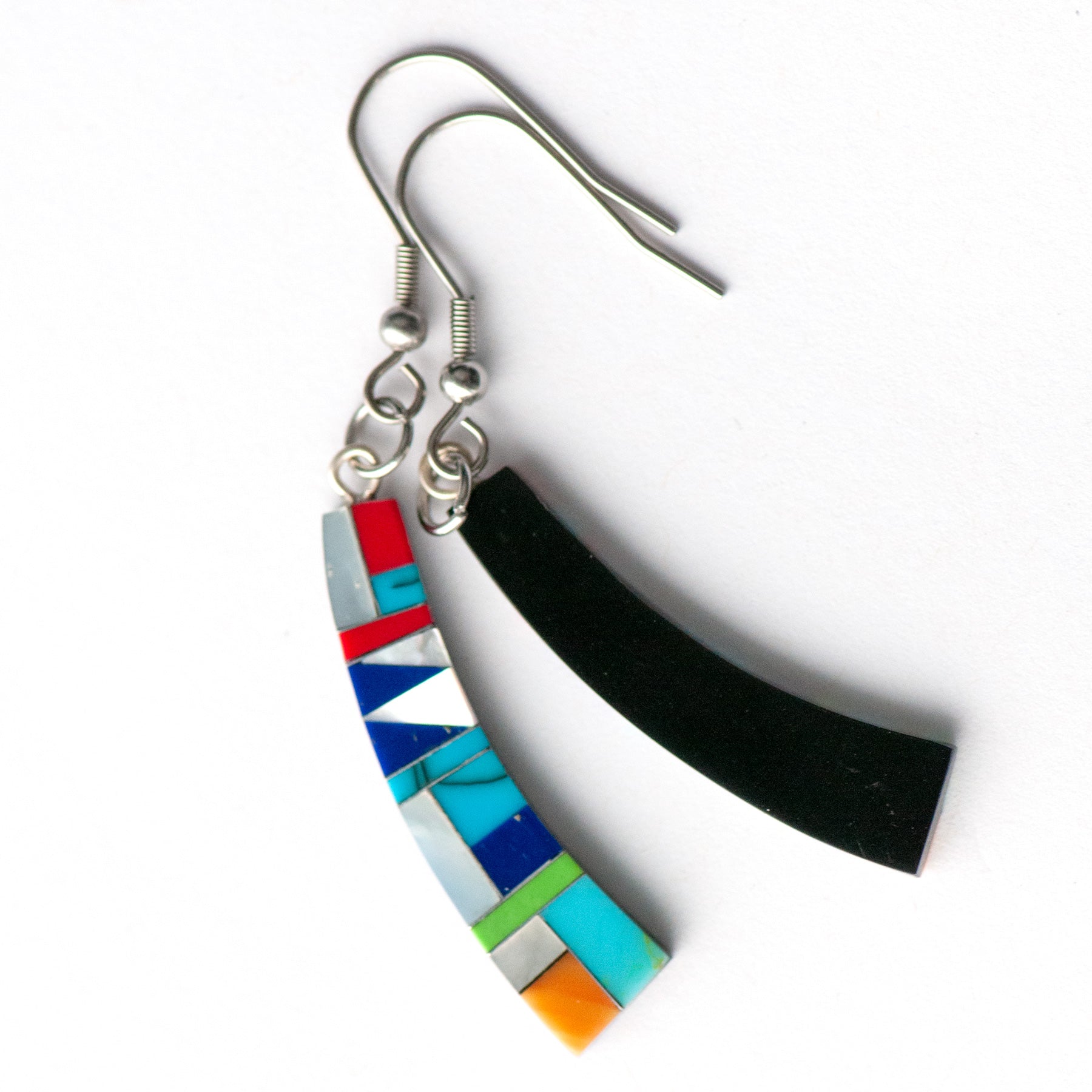 Turquoise Mosaic Curve Earrings featuring turquoise, coral, Mother of Pearl, and green and navy stones in a black resin curved rectangular design