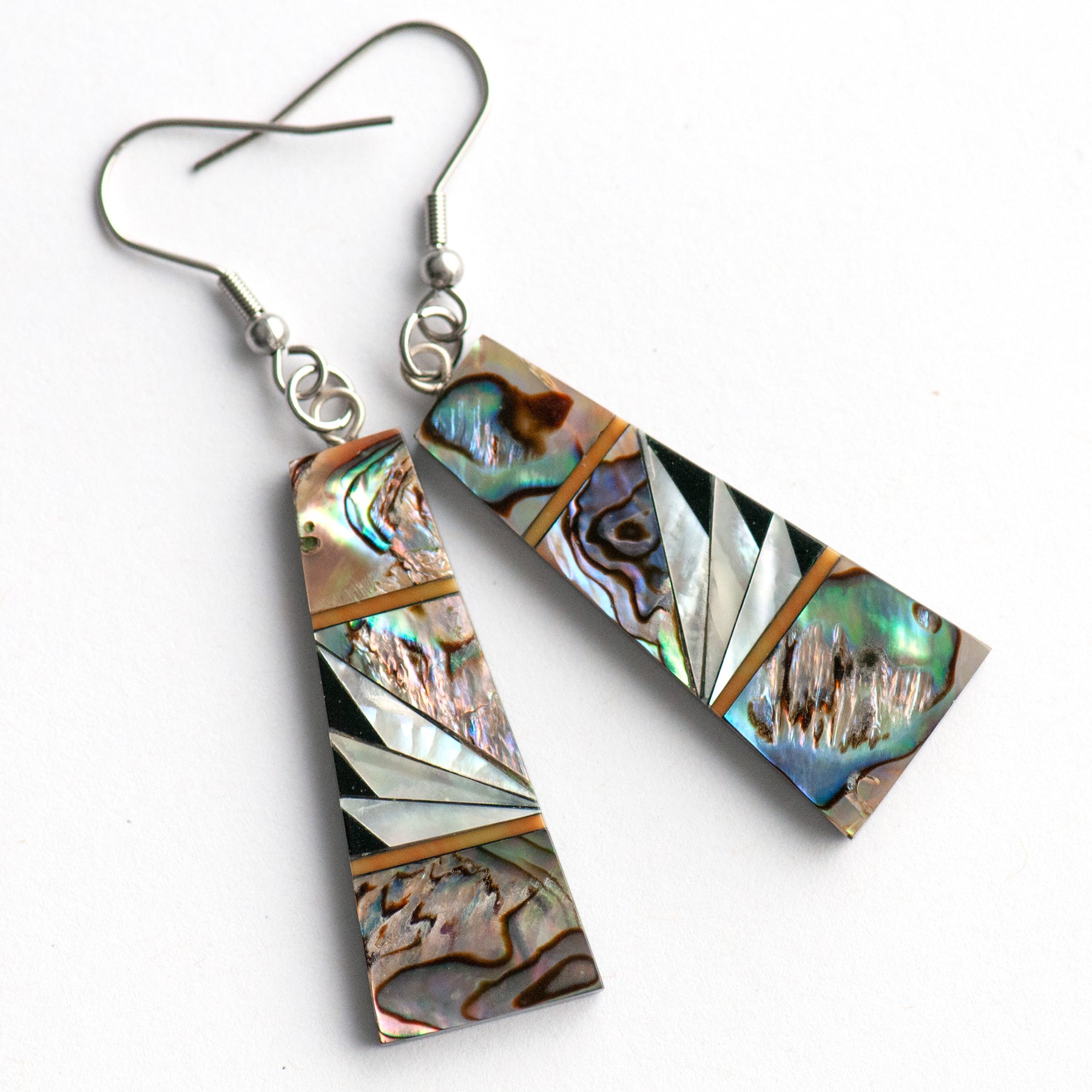 Abalone & Mother of Pearl Drop Earrings with shimmering silver, blue, and green abalone, creamy Mother of Pearl, and orange coral inlays on a black resin back.
