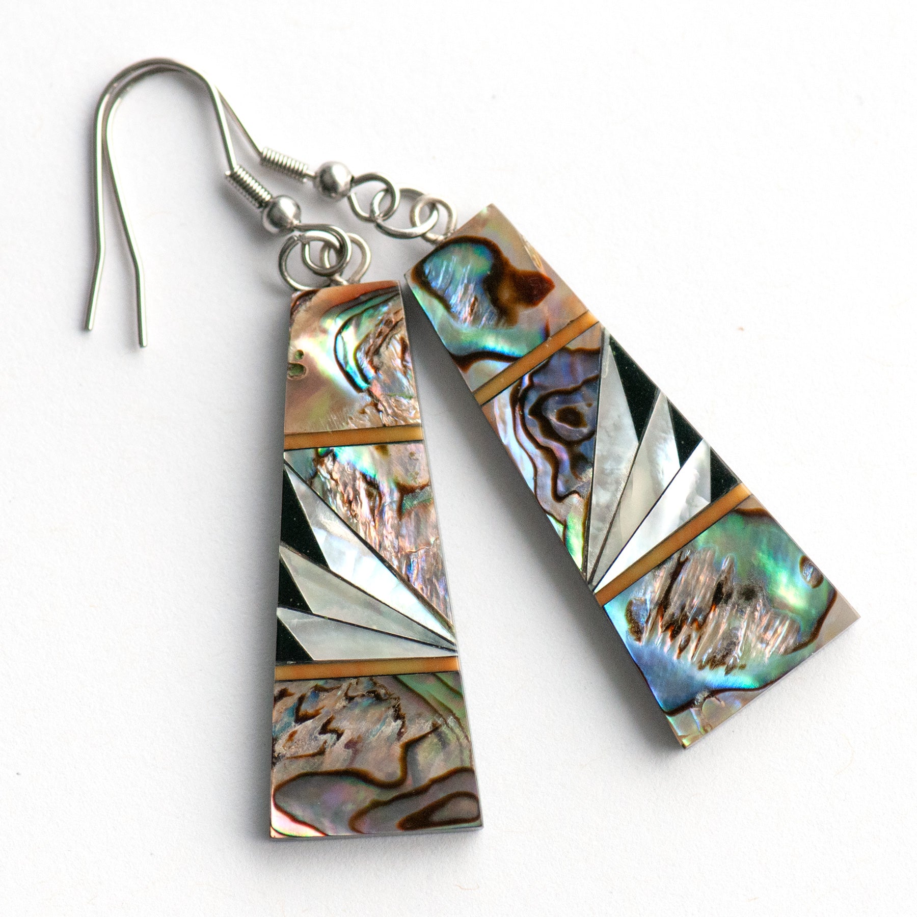 Abalone & Mother of Pearl Drop Earrings with shimmering silver, blue, and green abalone, creamy Mother of Pearl, and orange coral inlays on a black resin back.