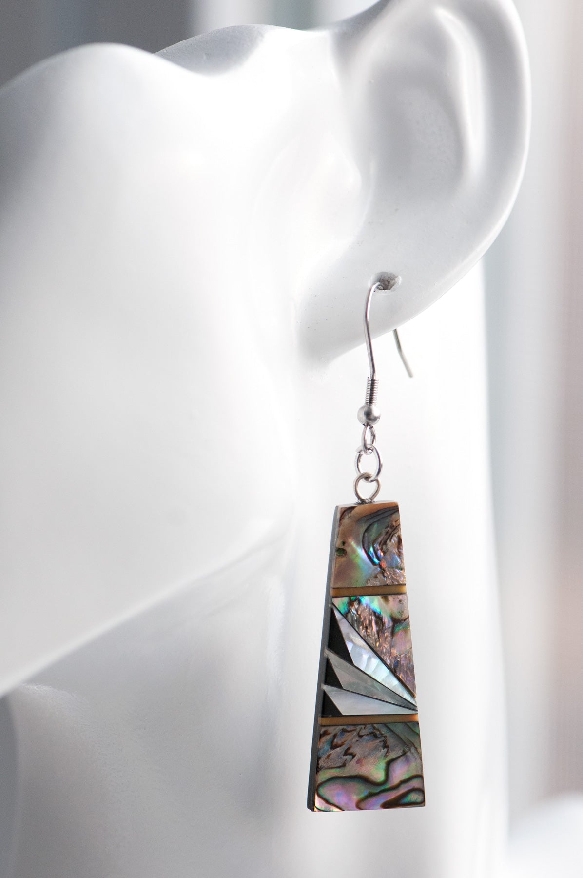 Abalone & Mother of Pearl Drop Earrings with shimmering silver, blue, and green abalone, creamy Mother of Pearl, and orange coral inlays on a black resin back.