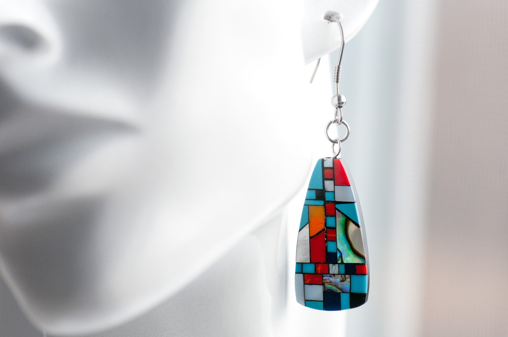 Turquoise & Shell Mosaic Drop Earrings featuring turquoise, coral, Mother of Pearl, and shimmering abalone in a black resin oblong design