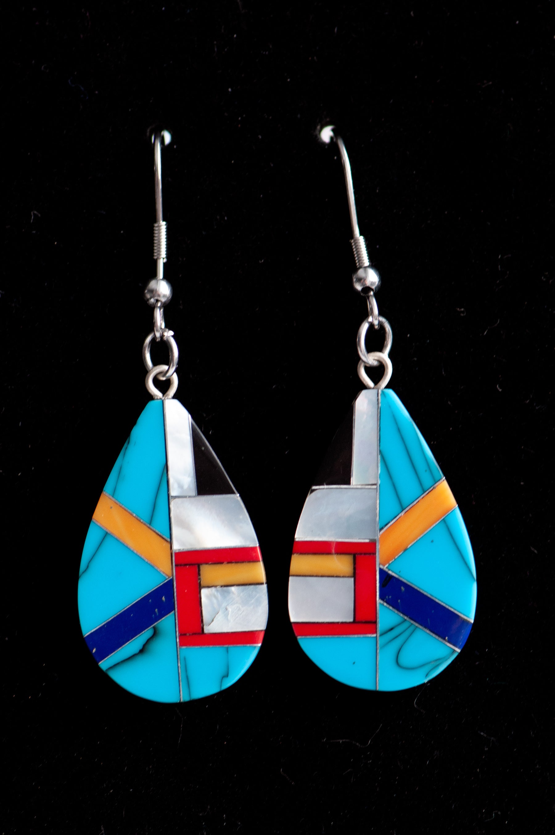 Turquoise & Pearl Teardrop Earrings featuring authentic turquoise, red and orange coral, and creamy Mother of Pearl in a black resin teardrop design.