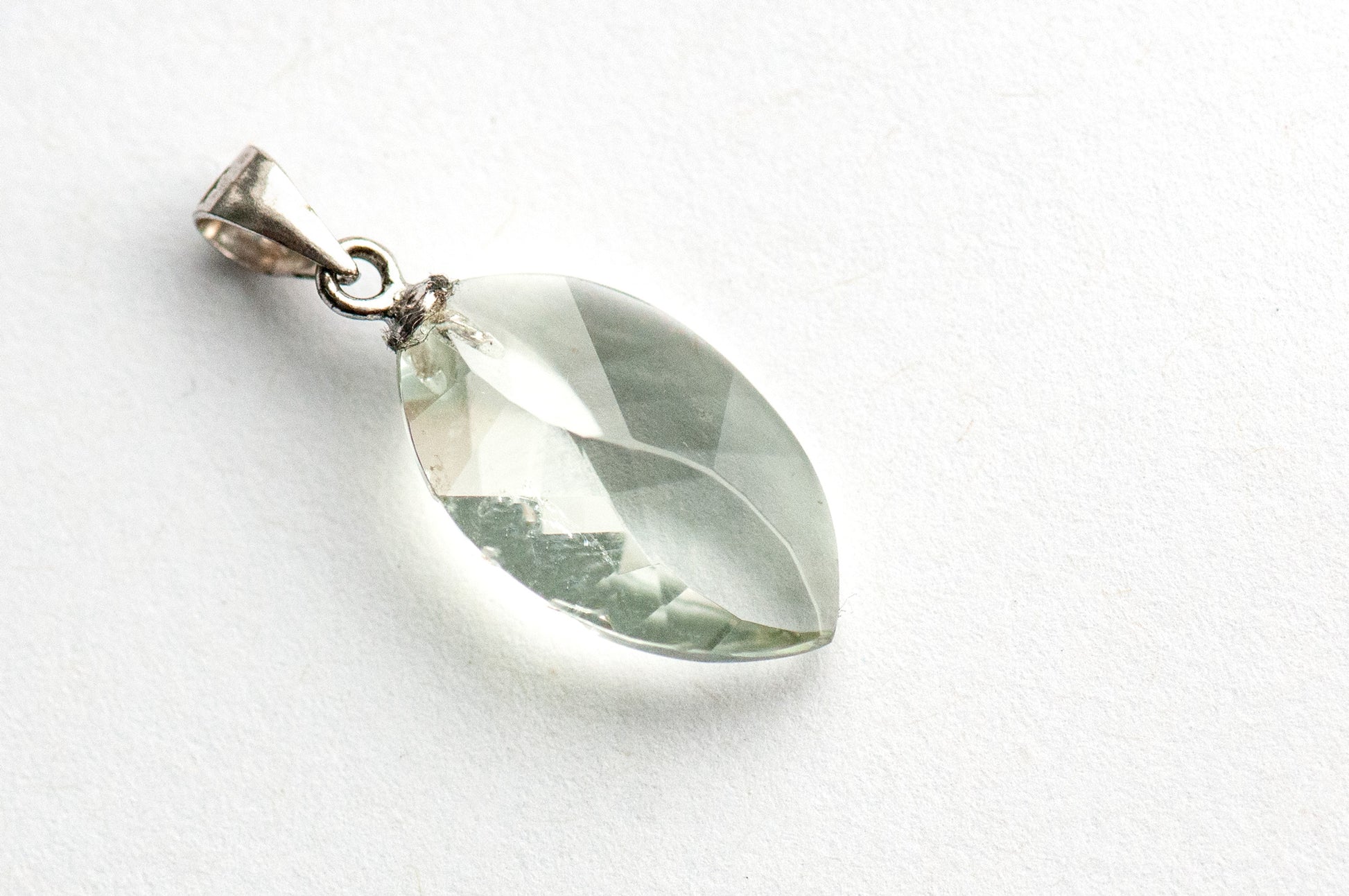 Prasiolite Leaf Lynx pendant featuring an 11x18mm leaf-faceted Green Amethyst with sterling silver bail.