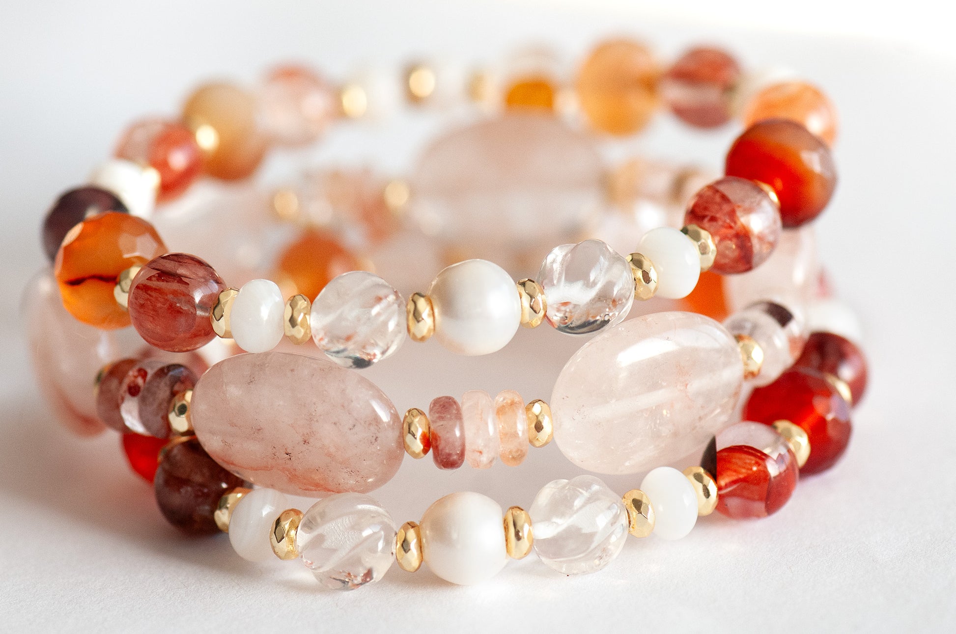 Aphrodite Bracelet Set featuring Hematoid Quartz, Carnelian, and freshwater pearls with gold-plated accents.