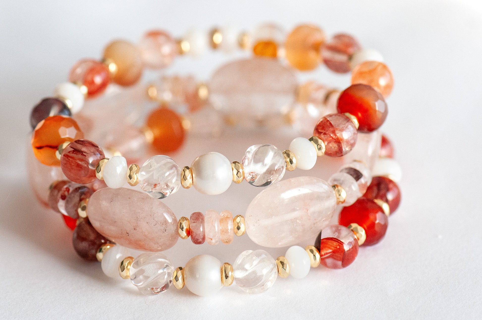 Aphrodite Bracelet Set featuring Hematoid Quartz, Carnelian, and freshwater pearls with gold-plated accents.
