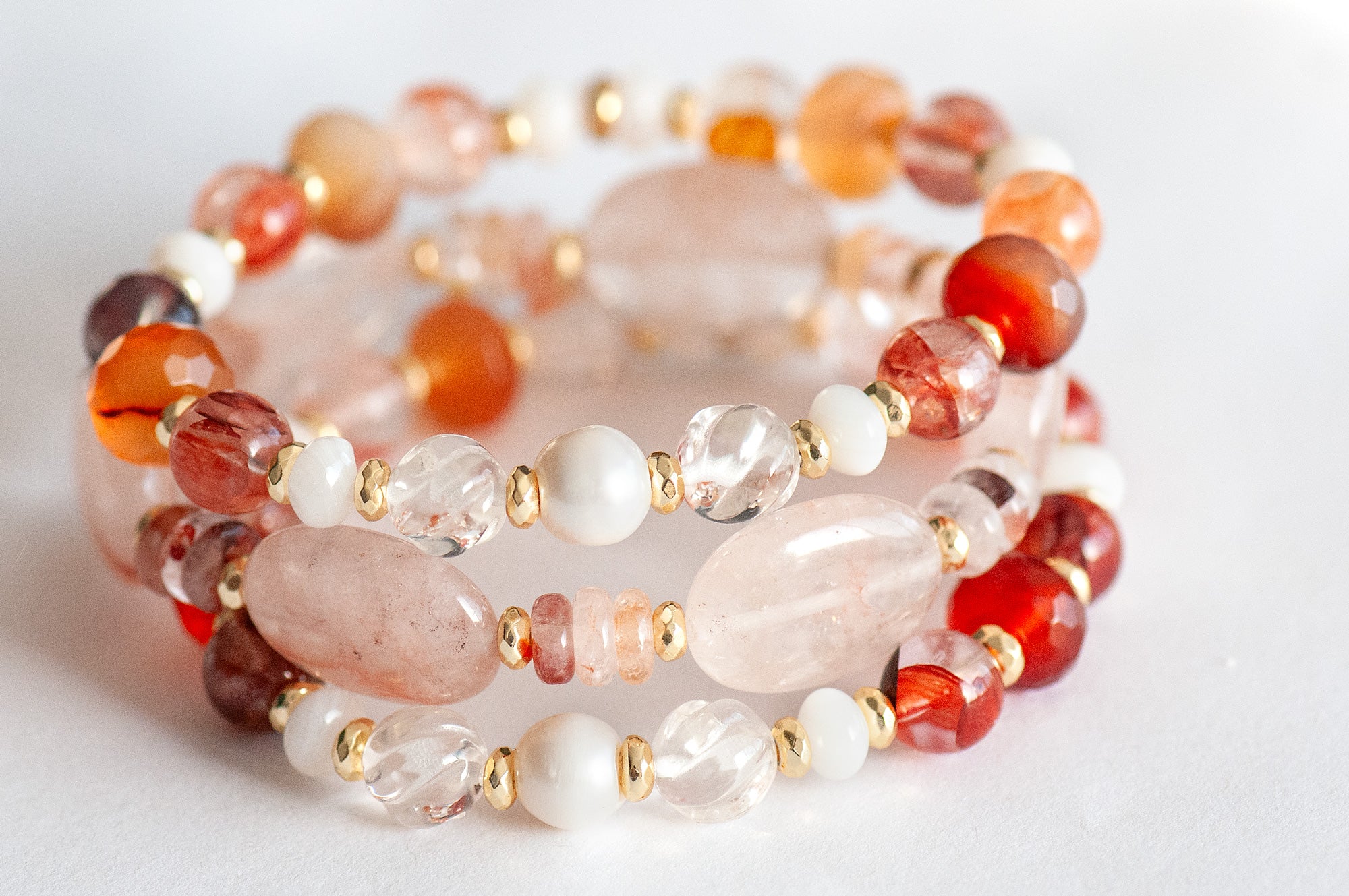 Aphrodite Bracelet Set featuring Hematoid Quartz, Carnelian, and freshwater pearls with gold-plated accents.