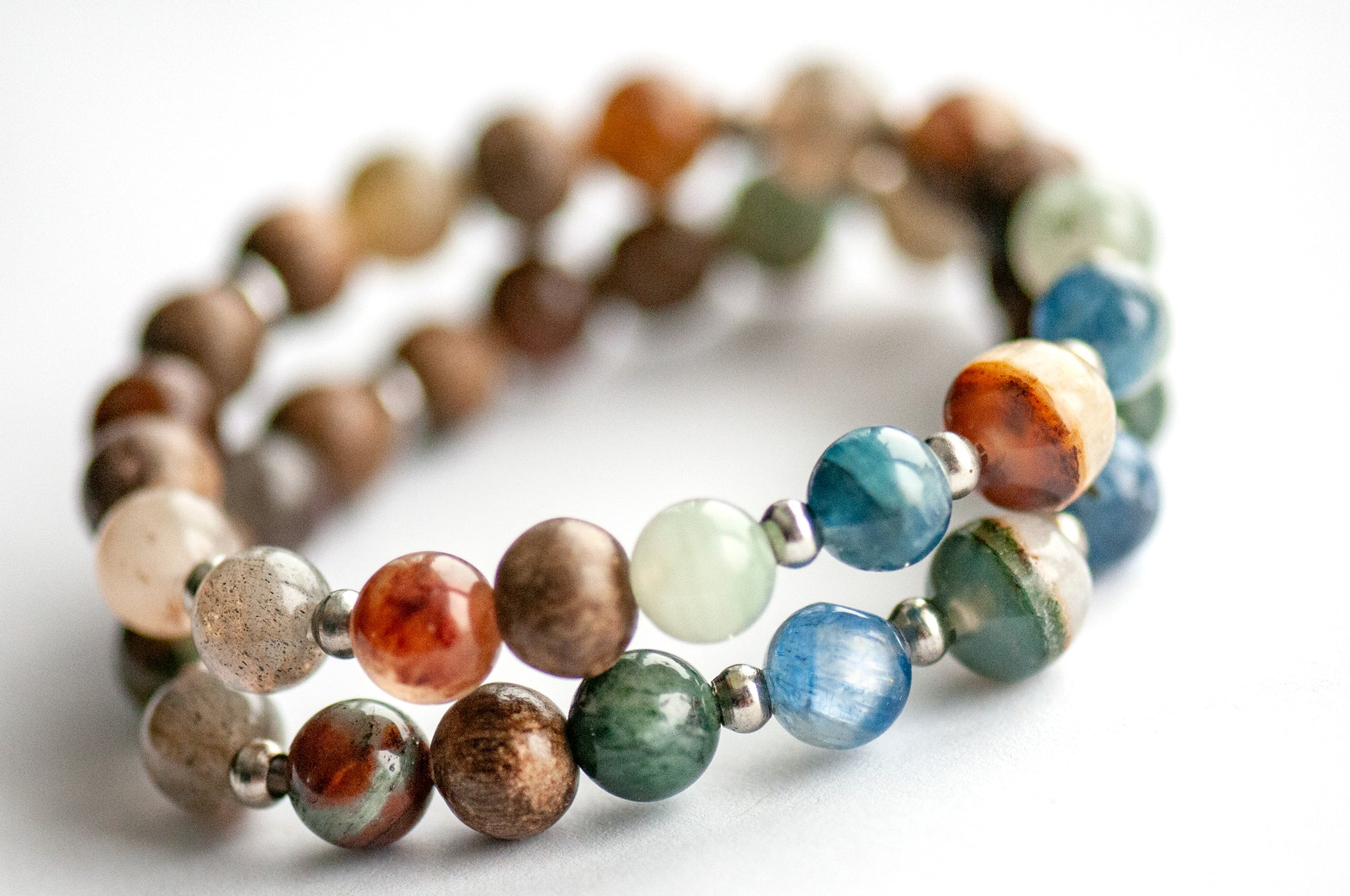 Supporting bracelets featuring Phantom Agate, Green-Red Phantom Quartz, and Wood Beads
