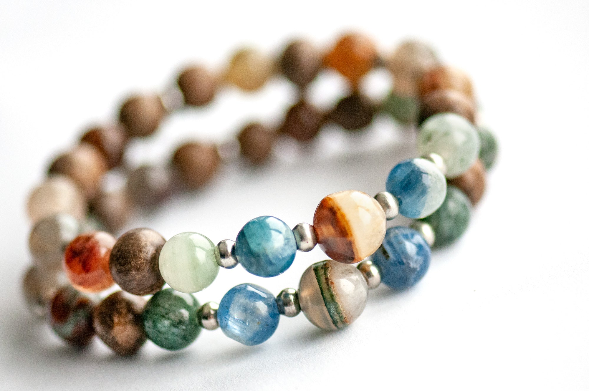 Supporting bracelets featuring Phantom Agate, Green-Red Phantom Quartz, and Wood Beads
