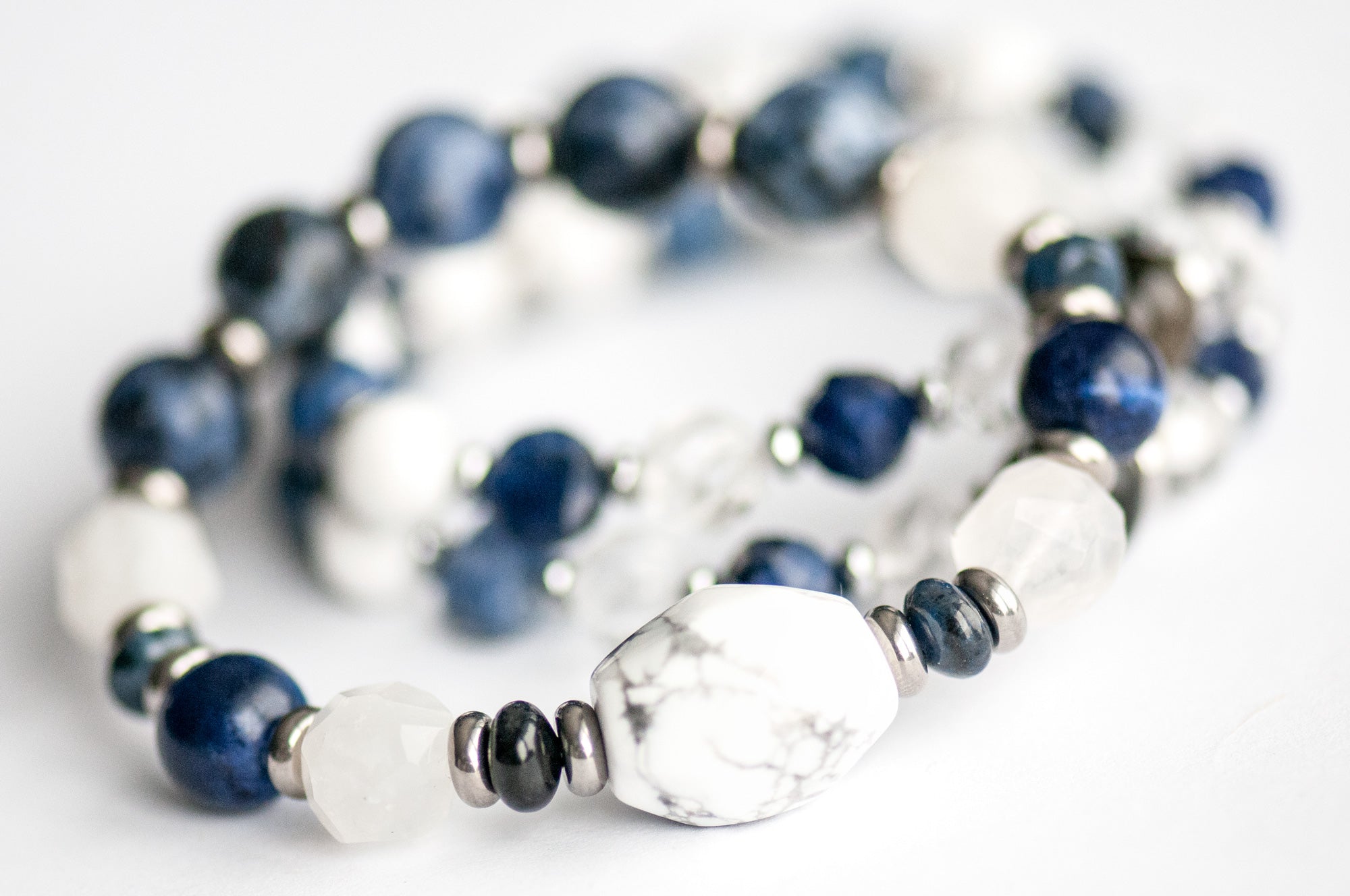 Close-up of White Howlite focal bead in the Neoclassical Lynx bracelet set