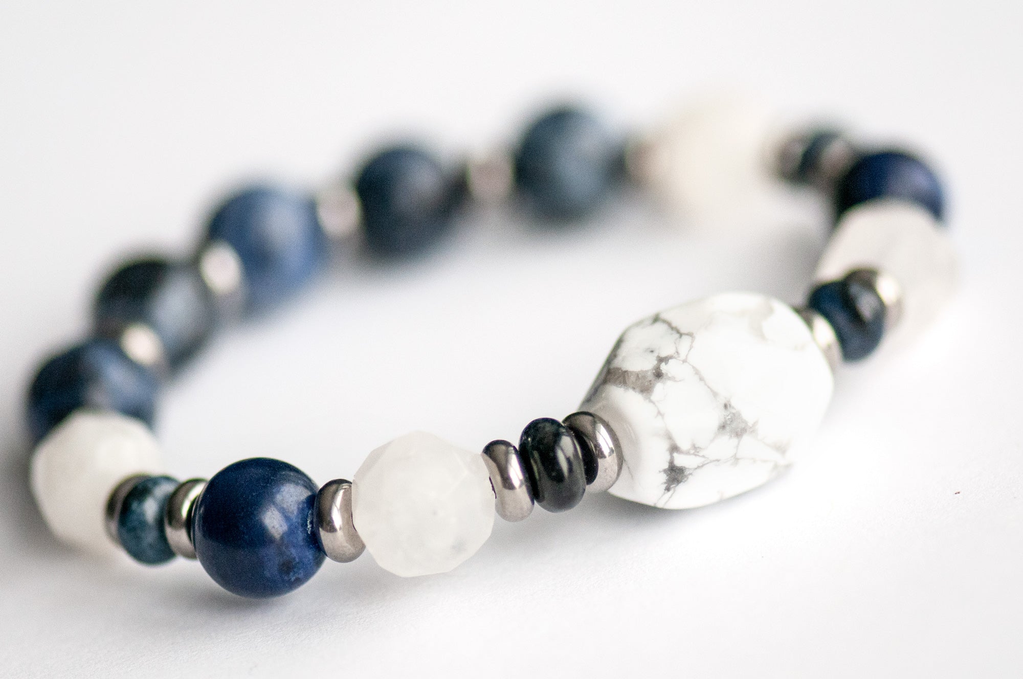 Close-up of White Howlite focal bead in the Neoclassical Lynx bracelet set