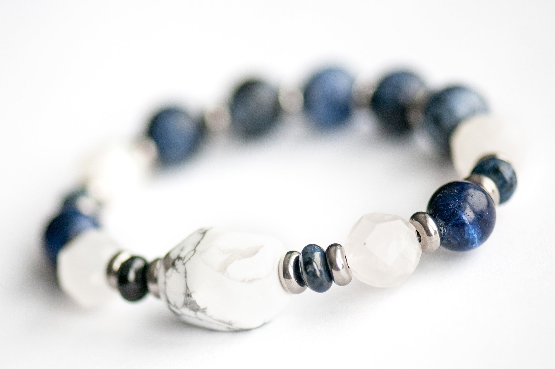 Close-up of White Howlite focal bead in the Neoclassical Lynx bracelet set