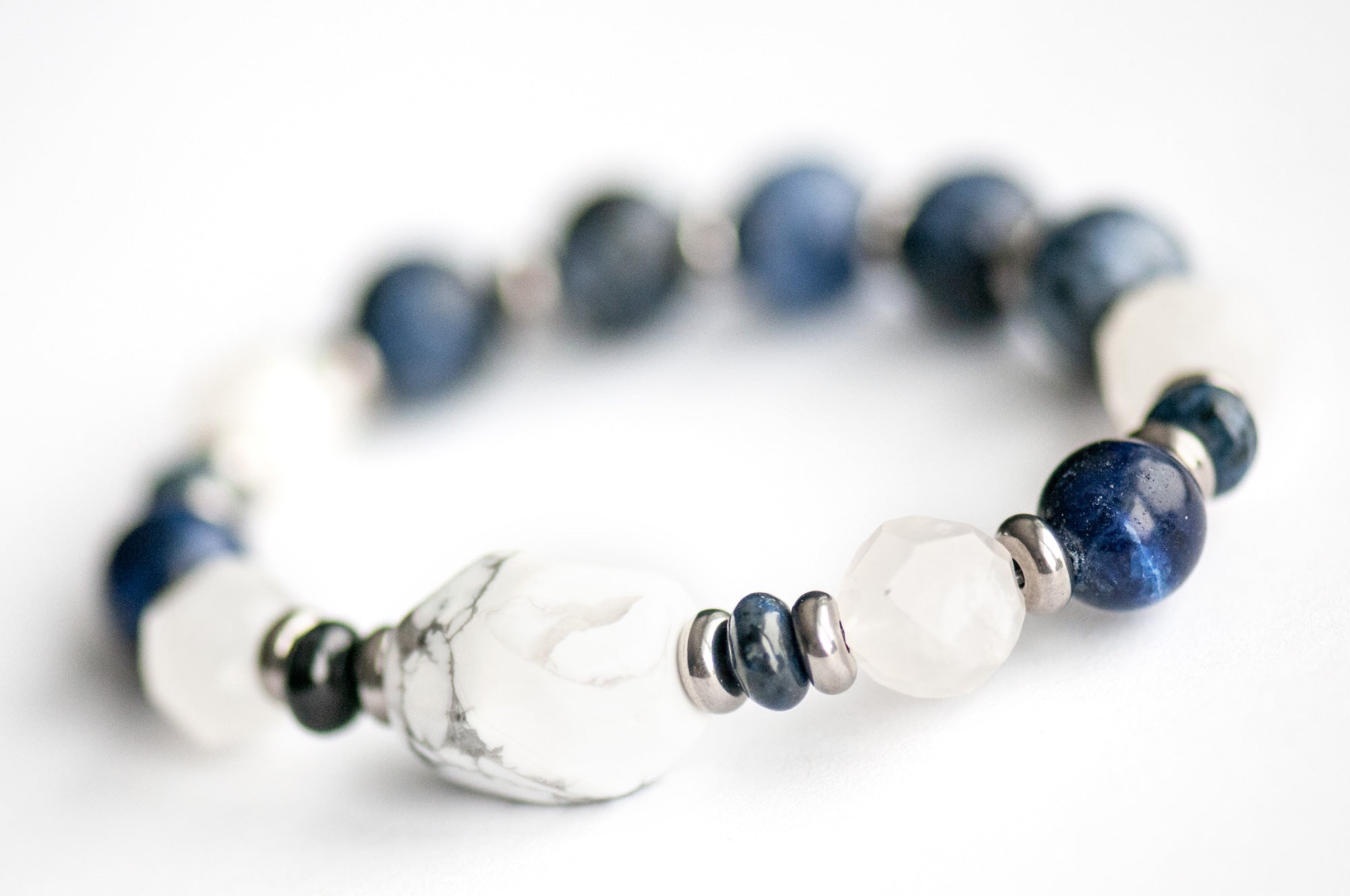 Close-up of White Howlite focal bead in the Neoclassical Lynx bracelet set