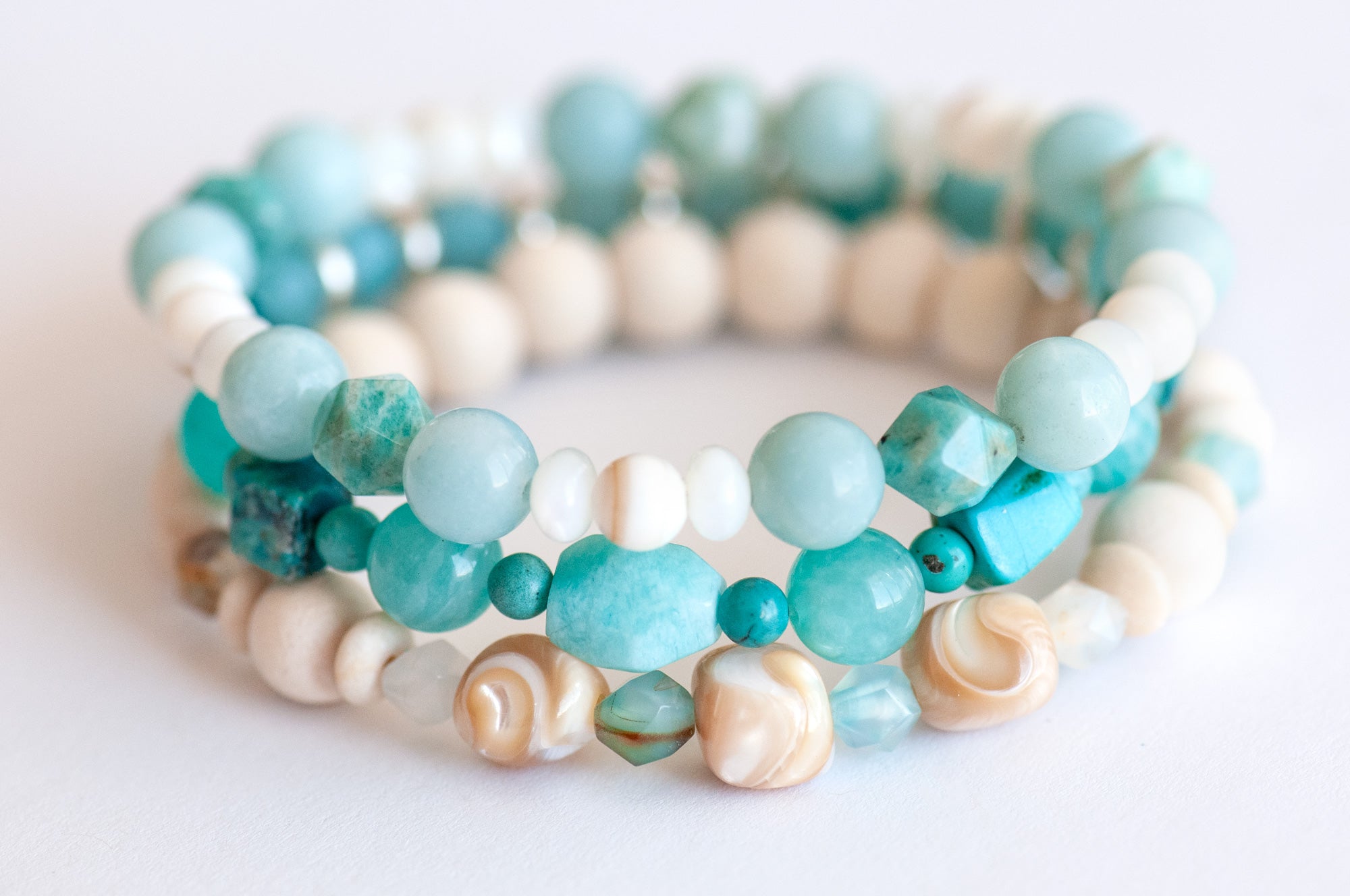 Voyage to Cuba bracelet set inspired by the beaches, sea, and sky of Cayo Cruz, featuring Amazonite, Chrysocolla, Fossil Stone, and Trocca Shell. A tropical getaway in every bead.