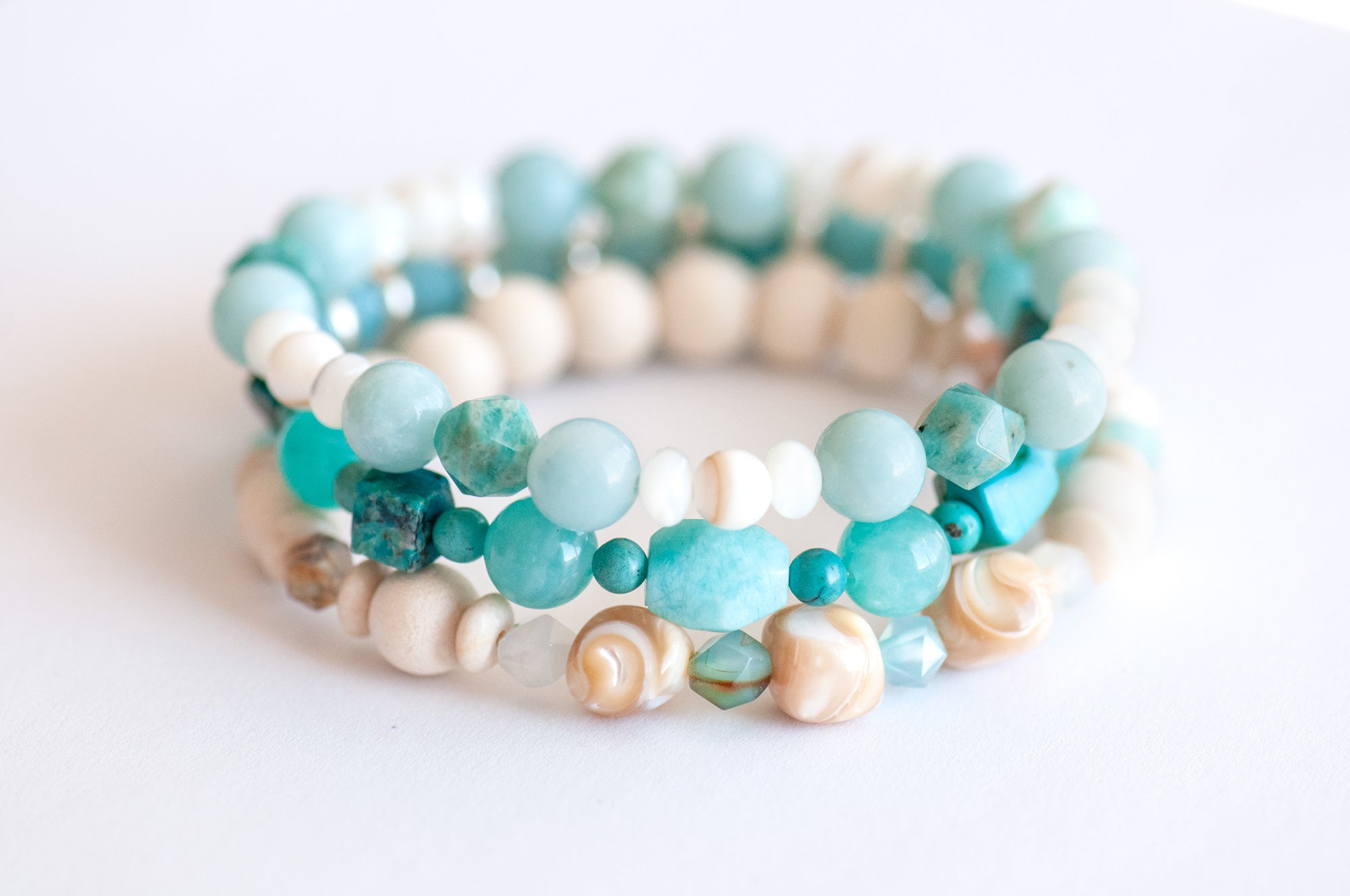 Voyage to Cuba bracelet set inspired by the beaches, sea, and sky of Cayo Cruz, featuring Amazonite, Chrysocolla, Fossil Stone, and Trocca Shell. A tropical getaway in every bead.