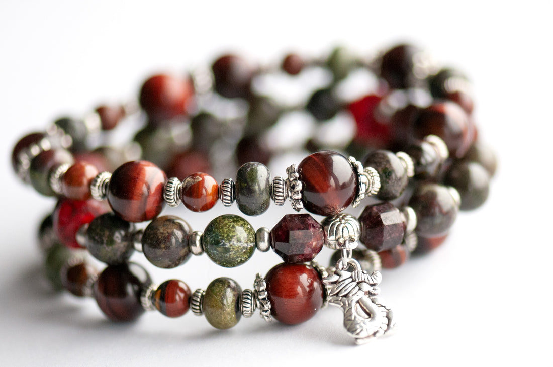 Flameborne Dragon bracelet set with Dragonblood Jasper, Garnet, Red Tiger Eye, Tiger Iron, and dragon charm – handcrafted by Fierce Lynx Designs