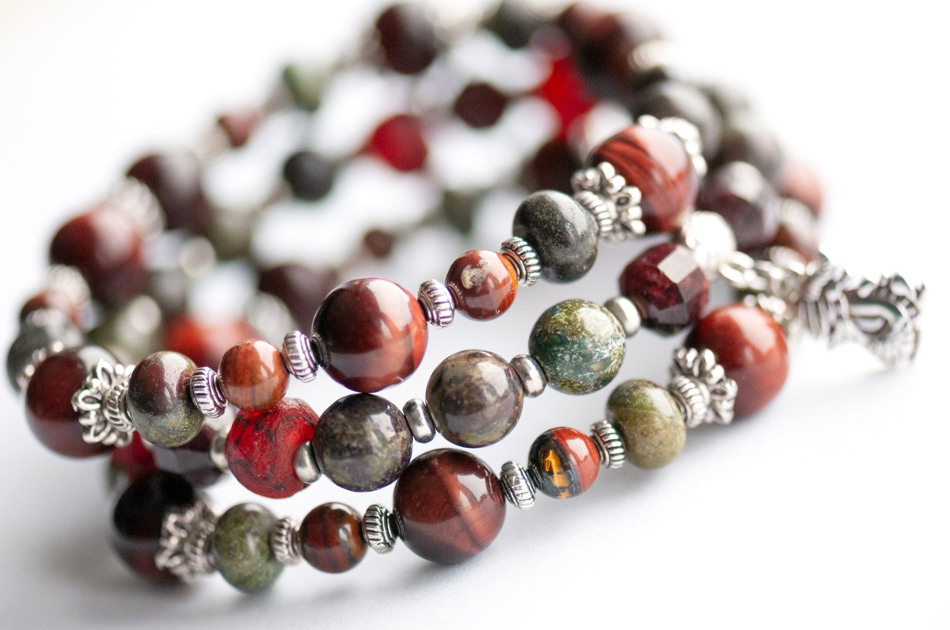 Flameborne Dragon bracelet set with Dragonblood Jasper, Garnet, Red Tiger Eye, Tiger Iron, and dragon charm – handcrafted by Fierce Lynx Designs