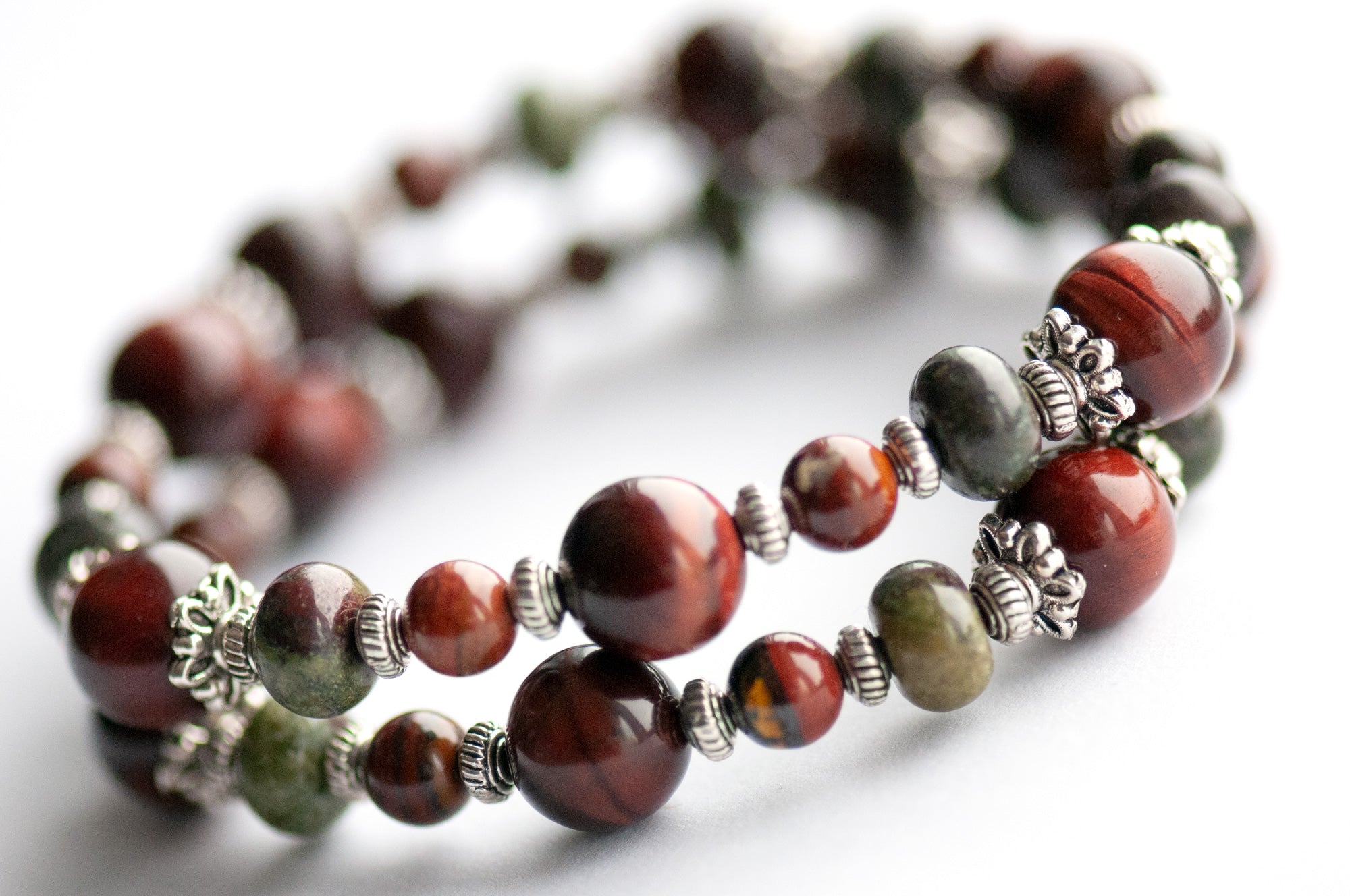 Flameborne Dragon bracelet set with Dragonblood Jasper, Garnet, Red Tiger Eye, Tiger Iron, and dragon charm – handcrafted by Fierce Lynx Designs