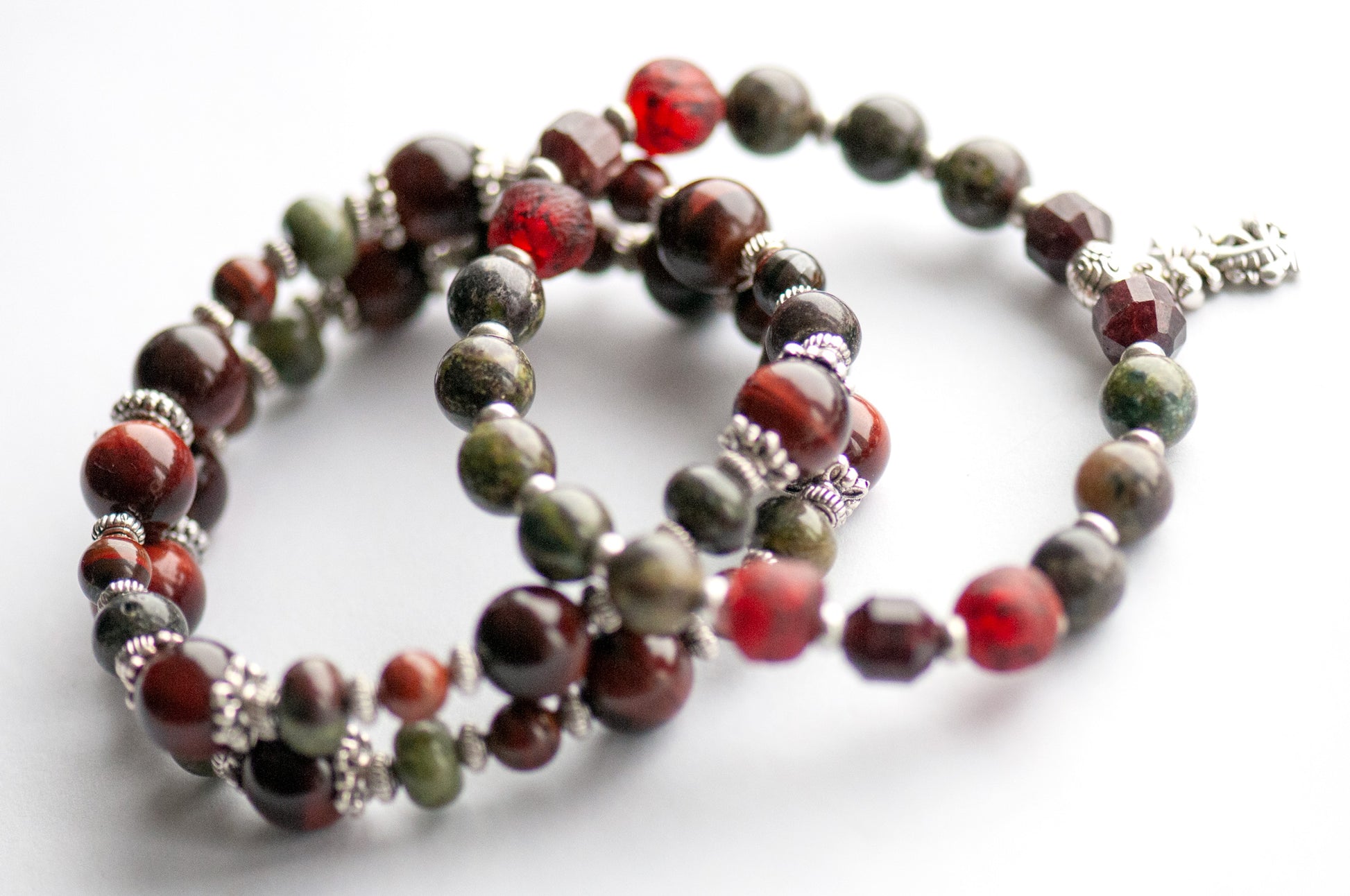 Flameborne Dragon bracelet set with Dragonblood Jasper, Garnet, Red Tiger Eye, Tiger Iron, and dragon charm – handcrafted by Fierce Lynx Designs