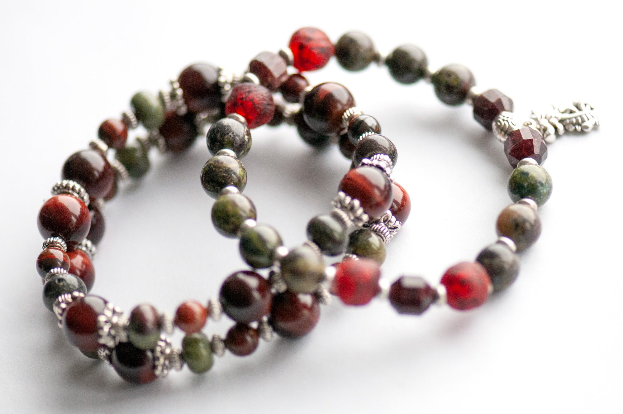 Flameborne Dragon bracelet set with Dragonblood Jasper, Garnet, Red Tiger Eye, Tiger Iron, and dragon charm – handcrafted by Fierce Lynx Designs