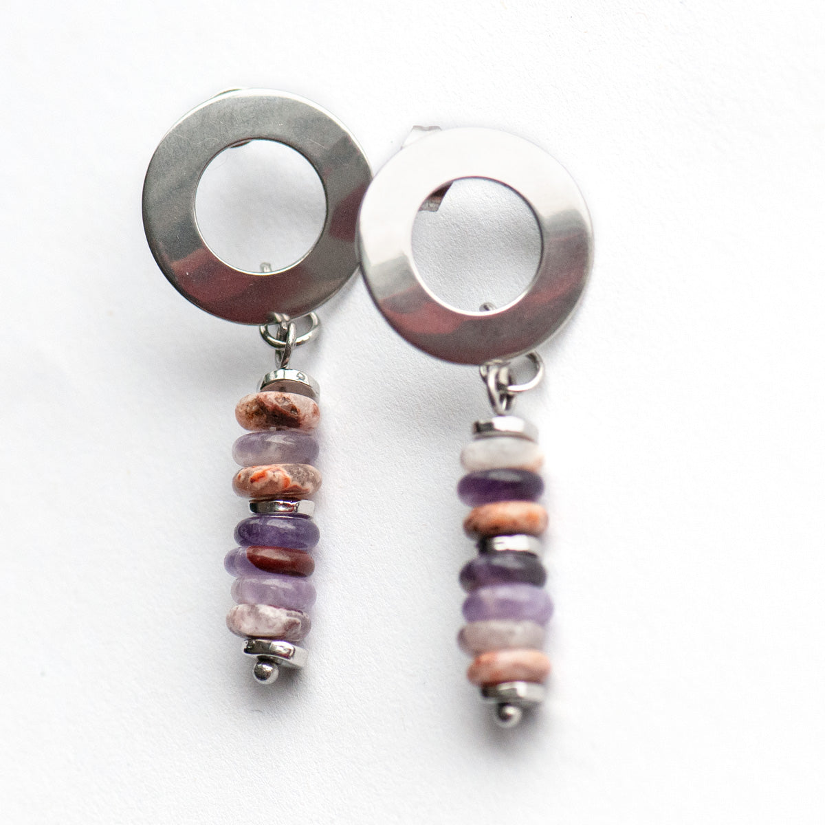 Delicate stud earrings with Dog Teeth Amethyst and silver accents. Lightweight and modern with a touch of mystical elegance—perfect for everyday wear.