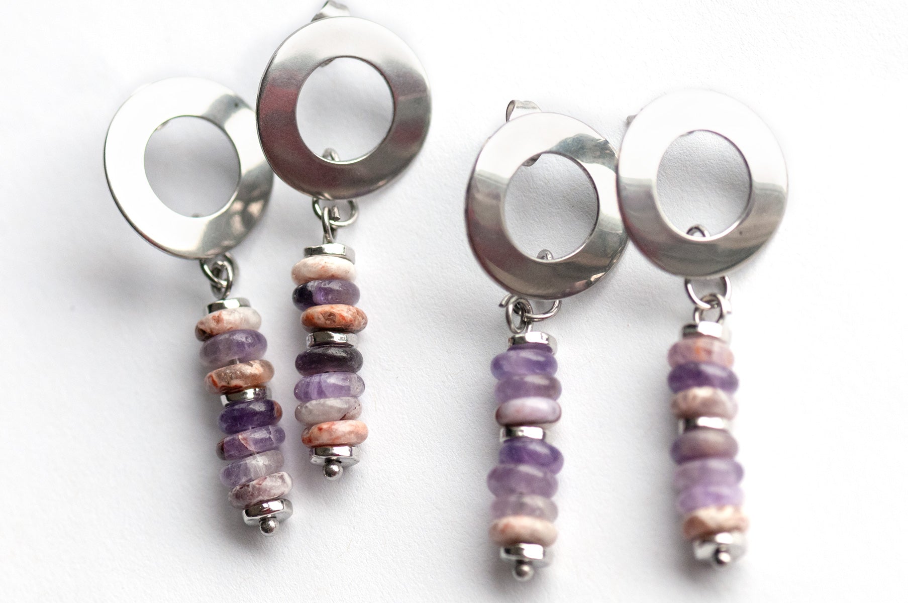 Delicate stud earrings with Dog Teeth Amethyst and silver accents. Lightweight and modern with a touch of mystical elegance—perfect for everyday wear.