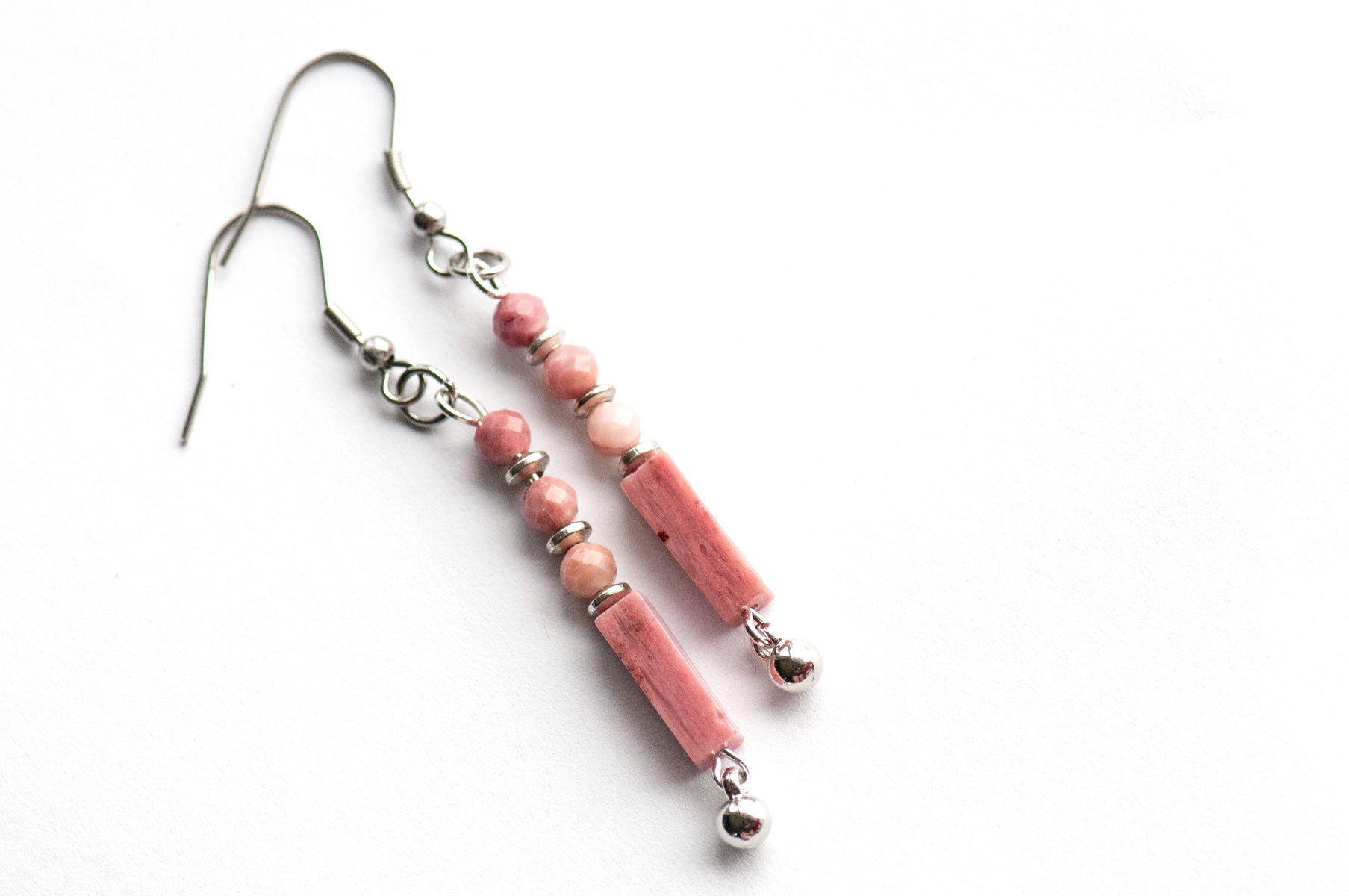 These delicate Rhodonite earrings feature ombré pink tones, micro-faceted beads, and silver accents. They are lightweight, elegant, and perfect for everyday wear.