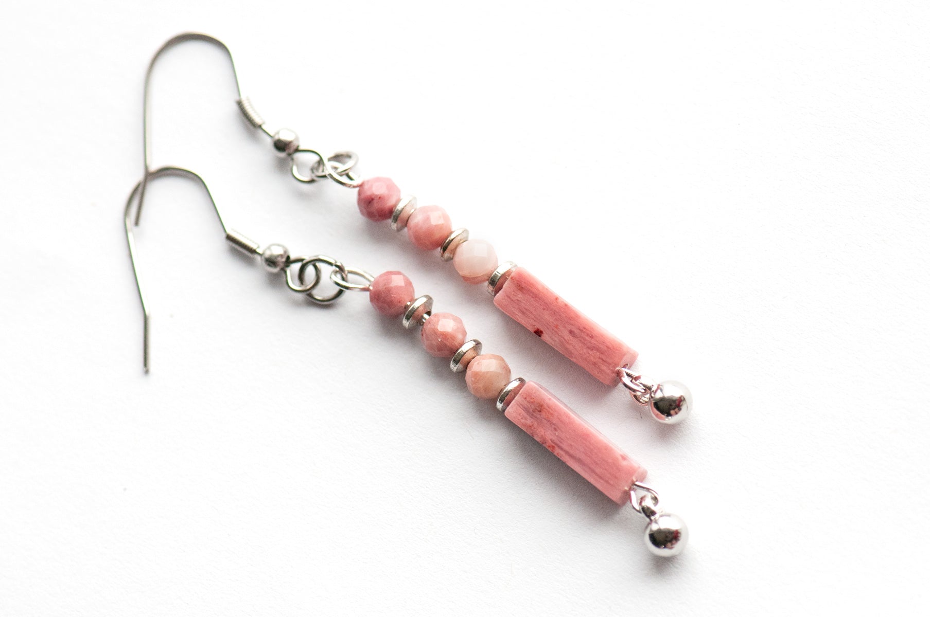These delicate Rhodonite earrings feature ombré pink tones, micro-faceted beads, and silver accents. They are lightweight, elegant, and perfect for everyday wear.