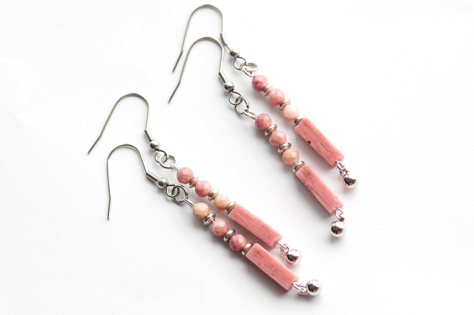 These delicate Rhodonite earrings feature ombré pink tones, micro-faceted beads, and silver accents. They are lightweight, elegant, and perfect for everyday wear.