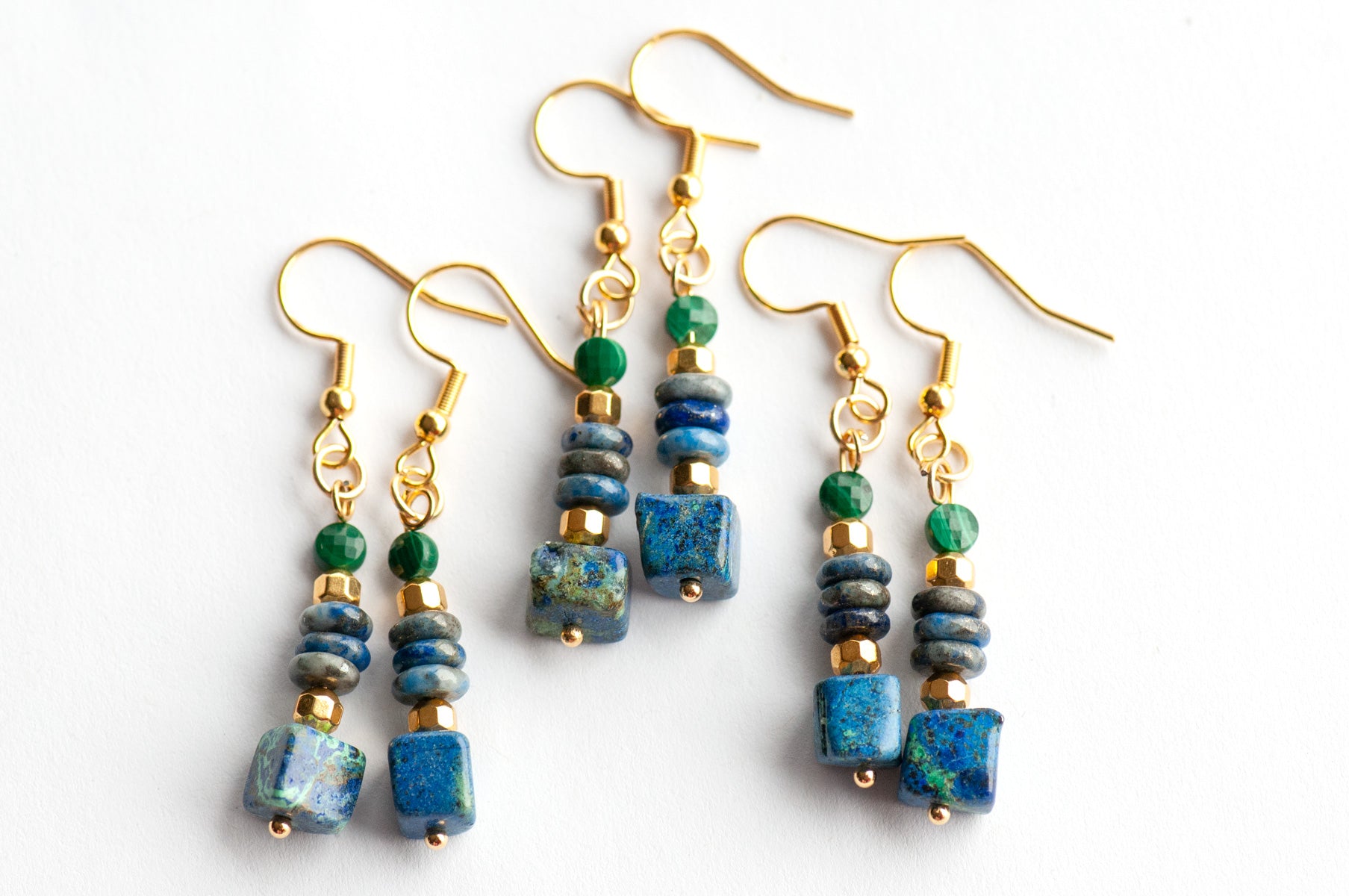 Elegant gemstone earrings featuring Azurite, Malachite, and Lapis with gold-plated accents. A mystical, lightweight design for everyday magic and style.