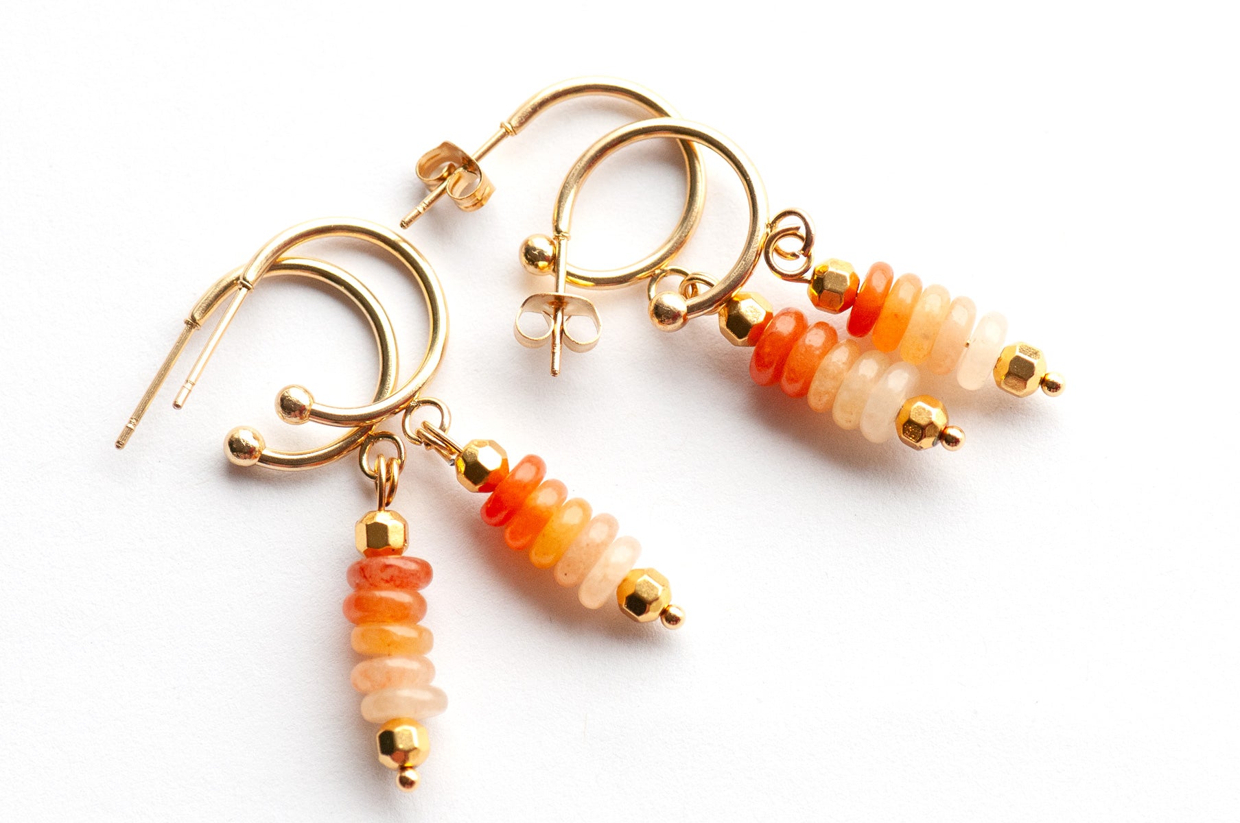 Elegant sunrise-inspired earrings with ombré Orange Aventurine and gold-plated accents. Lightweight half-hoop design for a warm, uplifting everyday look.